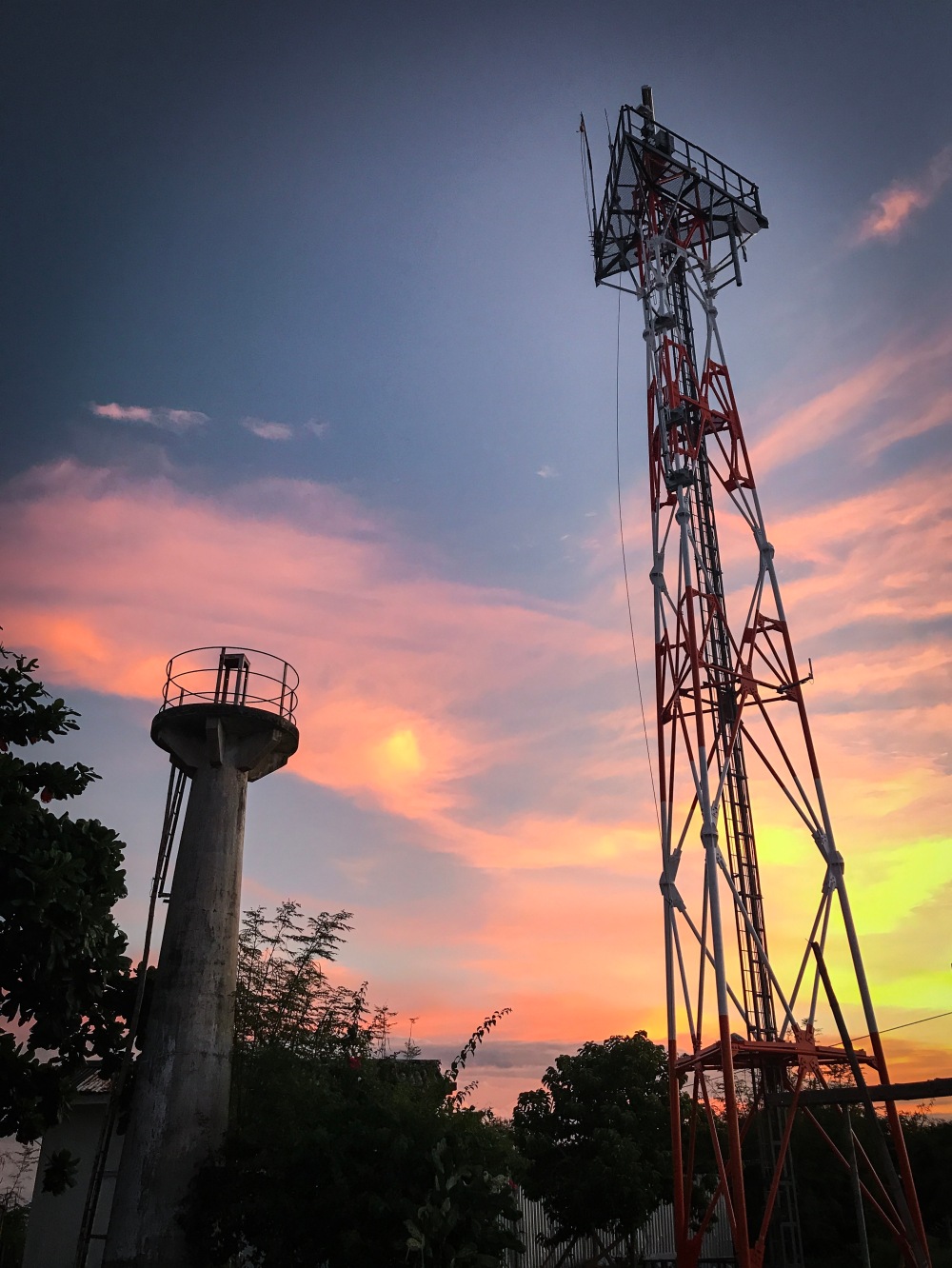 Apo Island's old lighthouse and network satellite