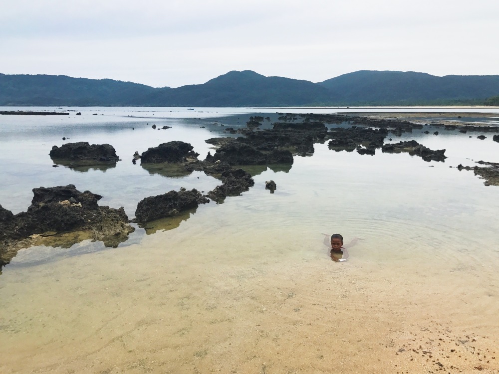 SEE THROUGH. Here's a young boy from the local neighborhood as he enjoys taking a dip in the clear waters of Casiguran. Notice, too, that the sand here has turned yellowish.