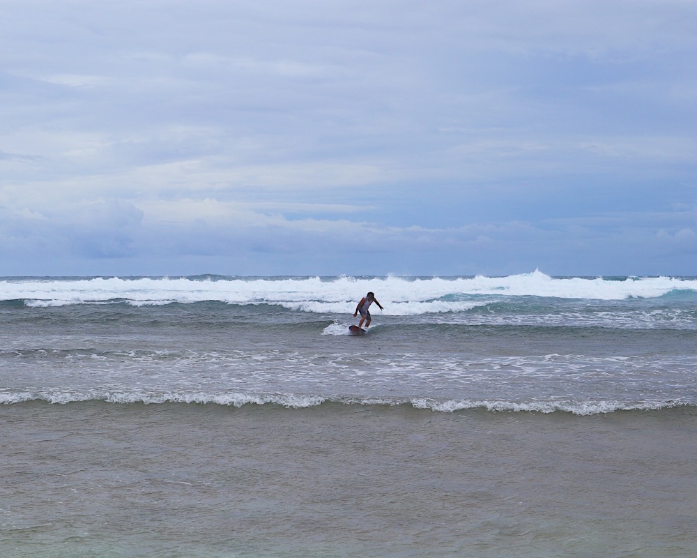 A surfer tries the waves of Guiuan.