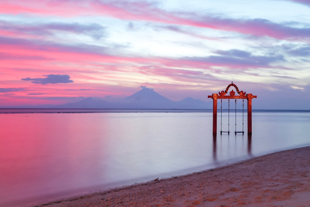 SUNSET IN LOMBOK. Ombak Swing with Mt. Agung at the background.