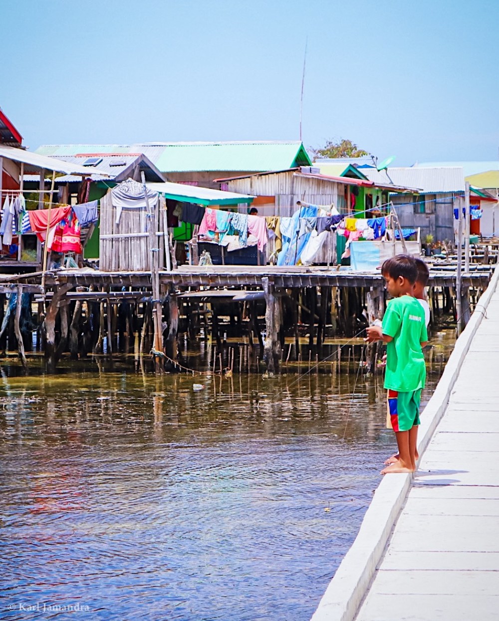 TWO KIDS FISHING.